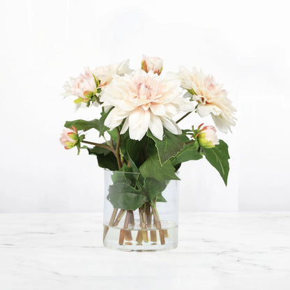 Soft peach dahlia arrangement with three blooms in a clear glass vase, 10 inches high